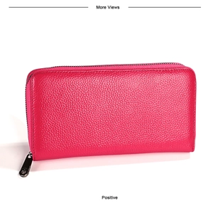 Close-up of rose red pebbled leather wallet with a secure wraparound zipper closure