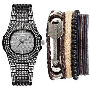 Detail of black iced-out watch with calendar and stacked leather bracelets for men