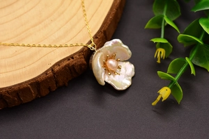 Macro shot of 925 silver baroque pearl flower necklace with natural textures