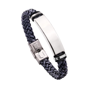 Detail of dark grey braided leather strap with polished stainless steel buckle on men bracelet