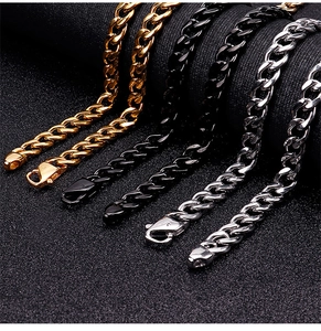 Close-up of Cuban link chains in gold, black, and silver finishes with lobster clasps