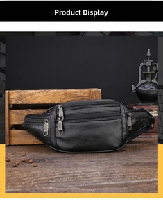 Close-up of black lychee leather waist bag featuring multi-layer zipper compartments