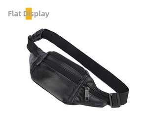 Flat lay of black waterproof leather fanny pack with multiple zipper pockets and buckle strap