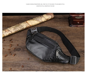 Multi-pocket black leather waist bag for men on vintage wooden desk with travel decor