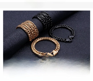 Detail showing gold and black stainless steel curb chain sets in punk style for men