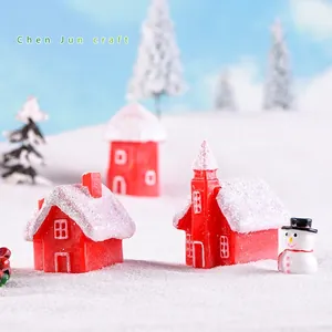 Christmas miniature resin house set with red candy cottages and snowman in snow scene