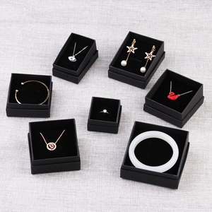 Set of black jewelry gift boxes with velvet lining for necklaces, rings and bracelets