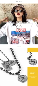 Detail of hiphop double-layer ball chain necklace with vintage metal pendant charms