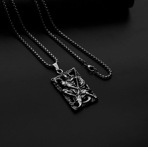 Macro detail of silver warrior pendant featuring matte titanium steel embossed relief