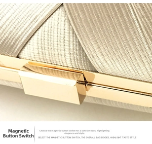 Detail of champagne satin pleated evening bag featuring a gold magnetic metal clasp