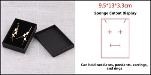 Detail of 9.5x13x3.3cm black kraft jewelry box with sponge slots for earrings and necklaces