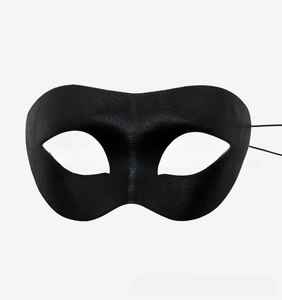 Close-up of a black fabric party eye mask with elegant minimalist design and elastic straps