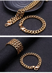 Detailed view of gold stainless steel Cuban chain necklace and bracelet set on black fabric