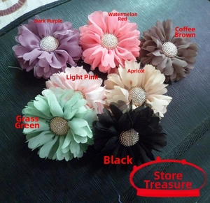 Detailed close-up of handmade multi-color fabric flowers with pearl beads for fascinators