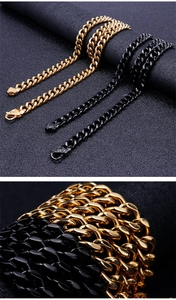 Detail of gold and black Cuban link necklaces showing heavy metal chain structure