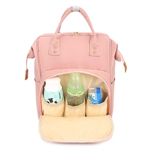 Pink nylon mummy backpack with insulated front pockets for baby bottles and snacks