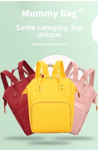 Close-up of quilted nylon mummy bags in red, yellow and pink with durable handles