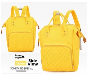Front and side view of large yellow quilted nylon diaper bag with multiple compartments