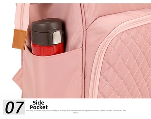 Close-up of pink quilted nylon diaper backpack with functional side pocket for water bottle