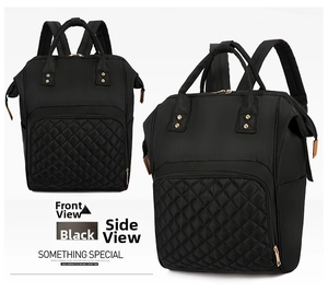 Detail view of black nylon mommy backpack featuring elegant diamond quilted texture and zippers