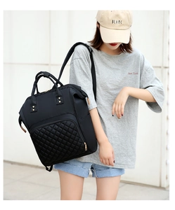 Side view of black nylon quilted backpack with large capacity for travel and mothers