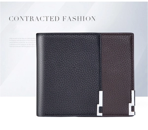 Detail of lychee textured leather wallets for men with elegant silver metal corner accents