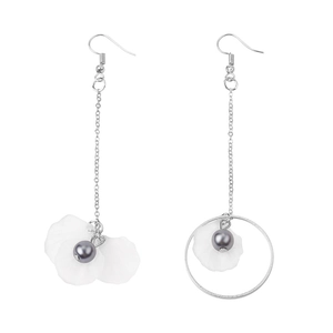 Detail of white petal earrings with grey pearls and silver asymmetric long tassels