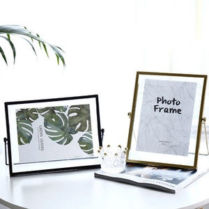 Minimalist metal photo frame set in black and gold finishes with glass panel for desk decor