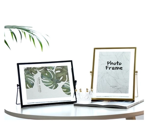 Modern geometric metal picture frames in gold and black finishes for stylish desk decor