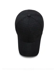 Top view of dark grey baseball cap with textured pattern and circular side logo