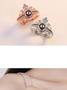 Detailed view of crown-shaped rings with sparkling diamonds and projection stones