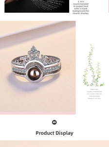 Detail of crown ring with zirconia stones and nanotech I Love You projection bead