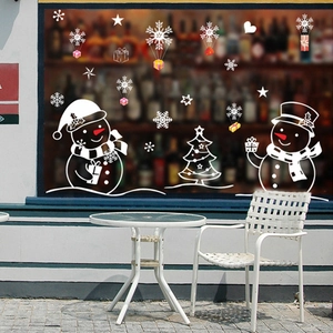 Festive white snowman and Christmas tree window stickers for holiday glass decor