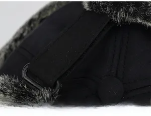Close-up of the adjustable strap and plastic buckle on the back of the black winter hat