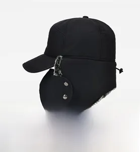Detail of men winter trapper hat with gray faux fur lining and removable face mask