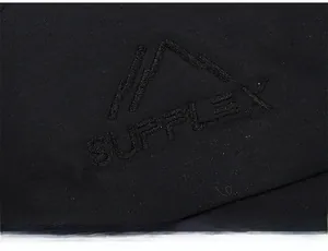 Detailed close-up of mountain peak embroidery and SUPFLEX logo on black winter hat