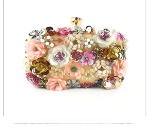 Detailed front view of evening clutch featuring 3D floral beadwork and golden frame