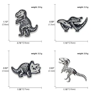 Size chart showing dinosaur fossil skeleton brooches with exact dimensions and weight