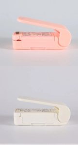 Close-up of pink and white portable mini heat sealers for plastic food bags