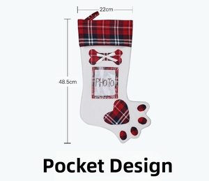 Close-up of dog paw Christmas stocking with photo pocket and red plaid details