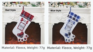 Detail of red and blue plaid dog paw Christmas stockings with photo windows for pets