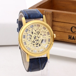 Detailed close-up of a vintage skeleton watch with blue leather strap and golden case