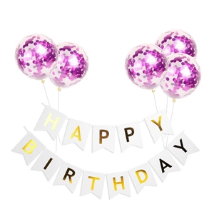 Detail view of Happy Birthday banner with golden letters and purple confetti balloons
