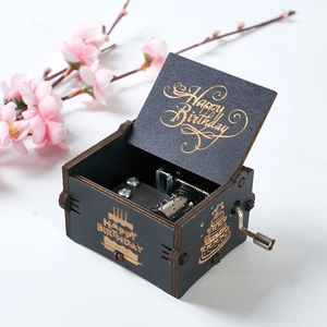 Black wooden hand-crank music box with golden Happy Birthday engraving and inner gear