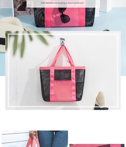 Close-up of mesh beach tote featuring black breathable net and pink nylon zipper pocket