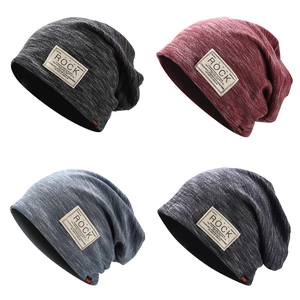 Detailed close-up of double-layered knit beanies with Rock patches in four versatile colors