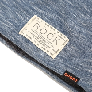 Men's blue knit beanie with warm black fleece lining and Rock patch detail