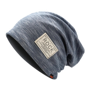 Navy blue melange knitted slouchy beanie with ROCK patch and orange SPORT label