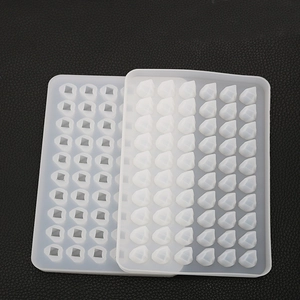 Detail view of 40-cavity square and teardrop silicone molds for DIY resin casting