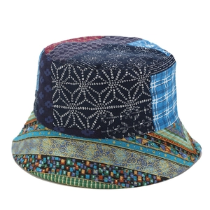 Close-up of colorful patchwork bucket hat showing mixed star and geometric fabric patterns